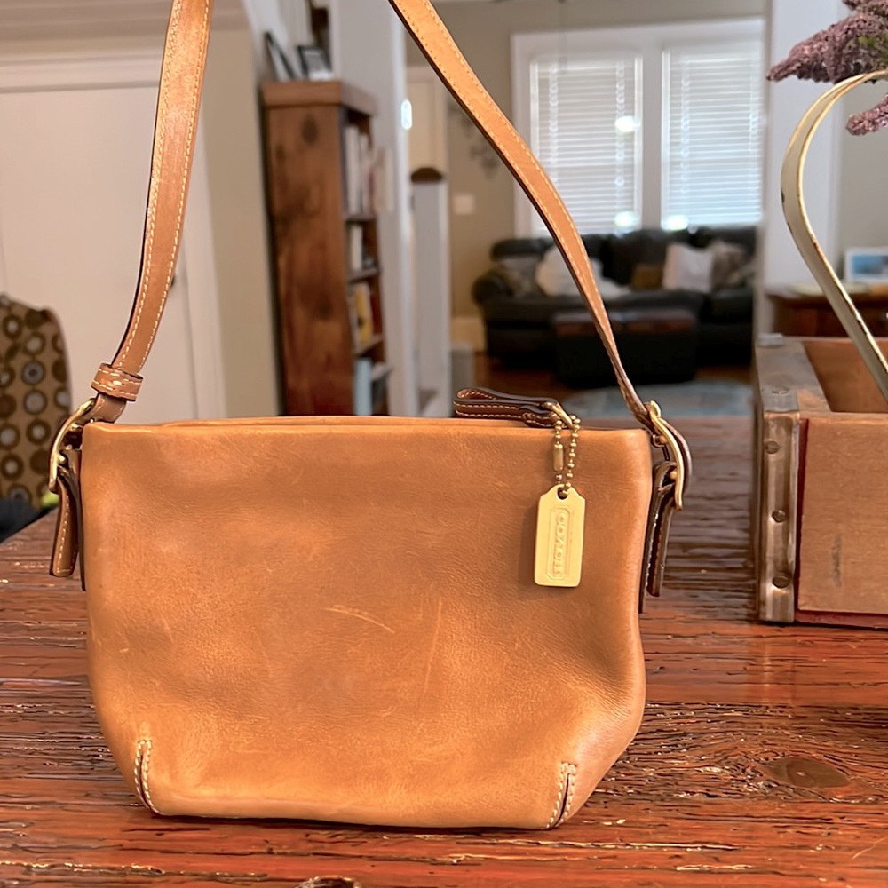 Never been used Coach purse, very small, genuine leather, perfect condition
